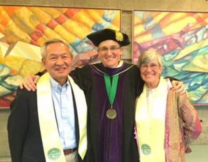 Photo of Jamie and her parents at law school graduation